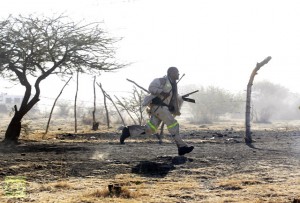 A miner runs as they were shot at by the police outside a South African mine in Rustenburg
